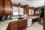 Fully equipped kitchen with granite countertops and dishwasher